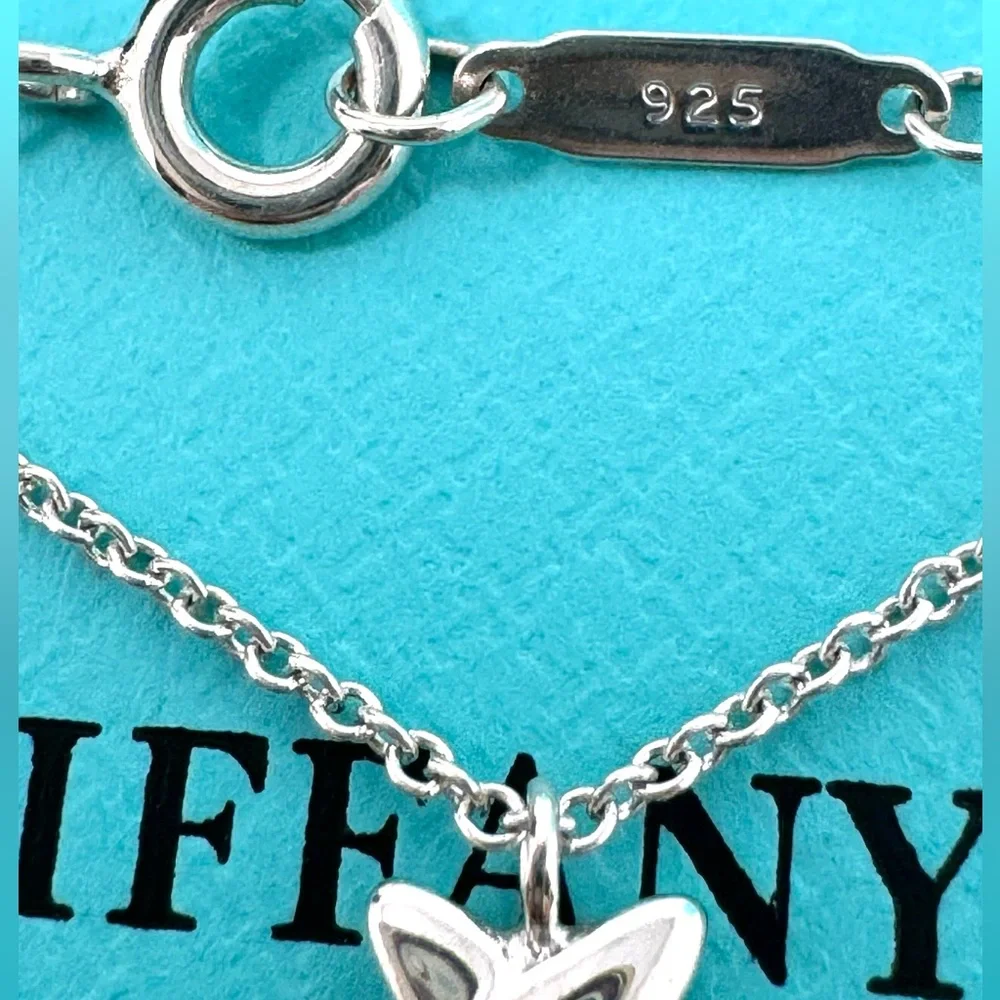 Authentic Tiffany & co. Triple X Kiss Cross Drope Necklace.
